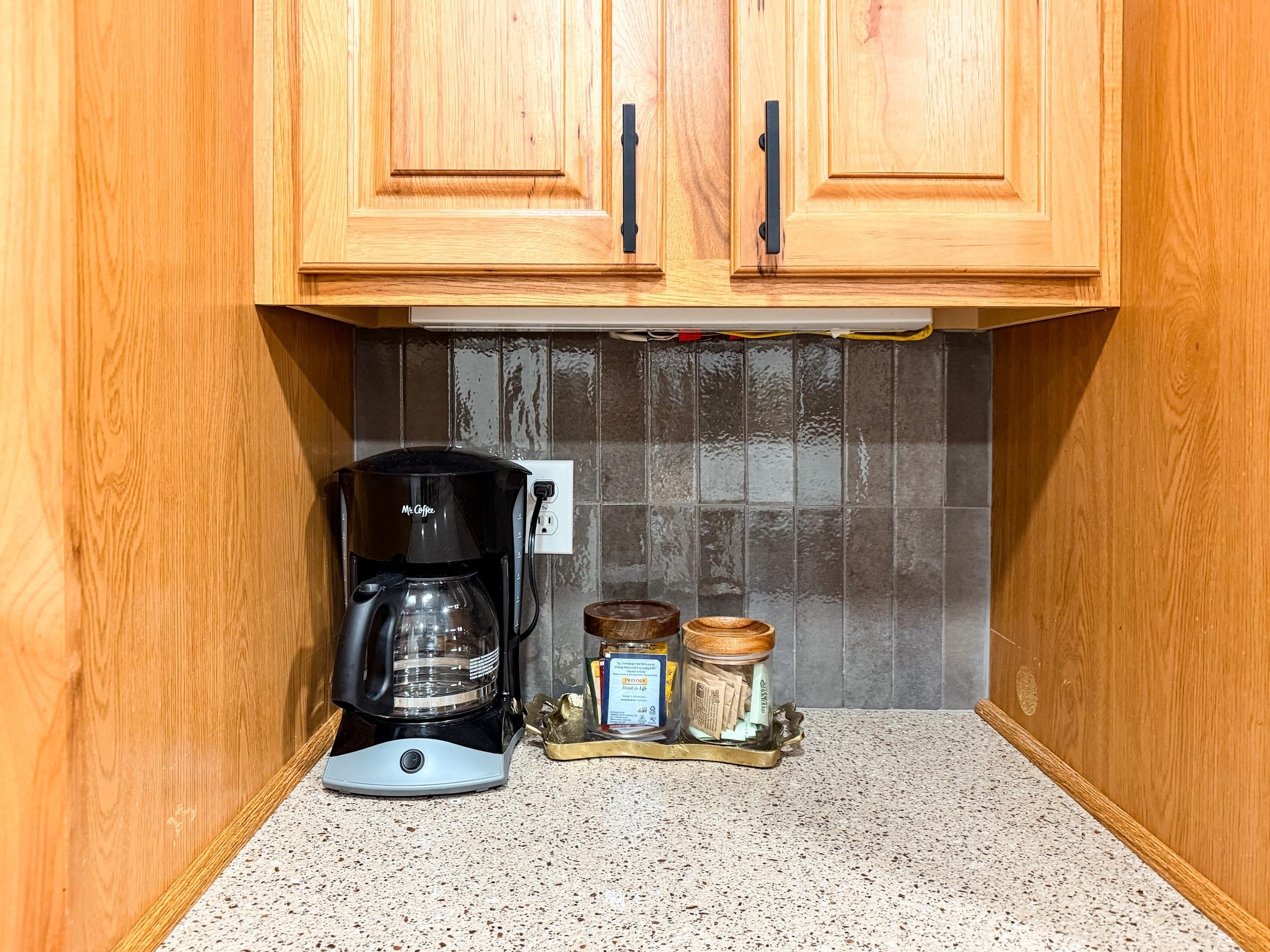 Standard drip coffee maker with filters are provided for guests