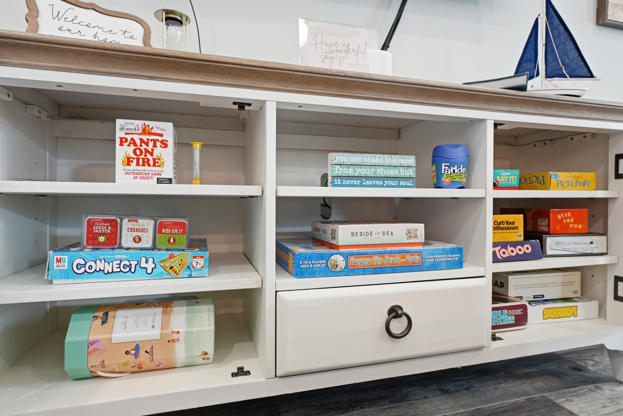 Choose from plenty of family fun games and books, right in the living room TV cabinet.