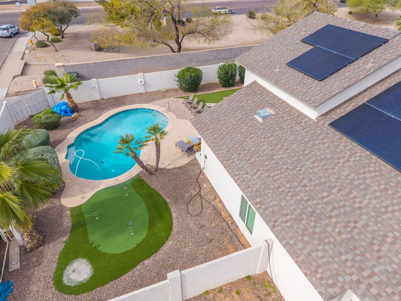 A sparkling pool paired with a resort-worthy backyard escape.