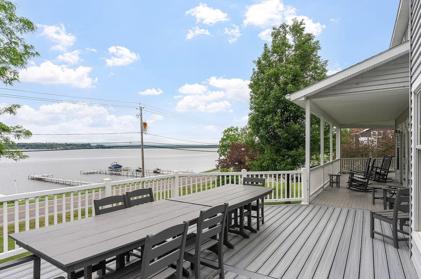 Enjoy lakeside dining on the spacious firs-floor deck featuring a large double dining table and beautiful Saratoga Lake views.