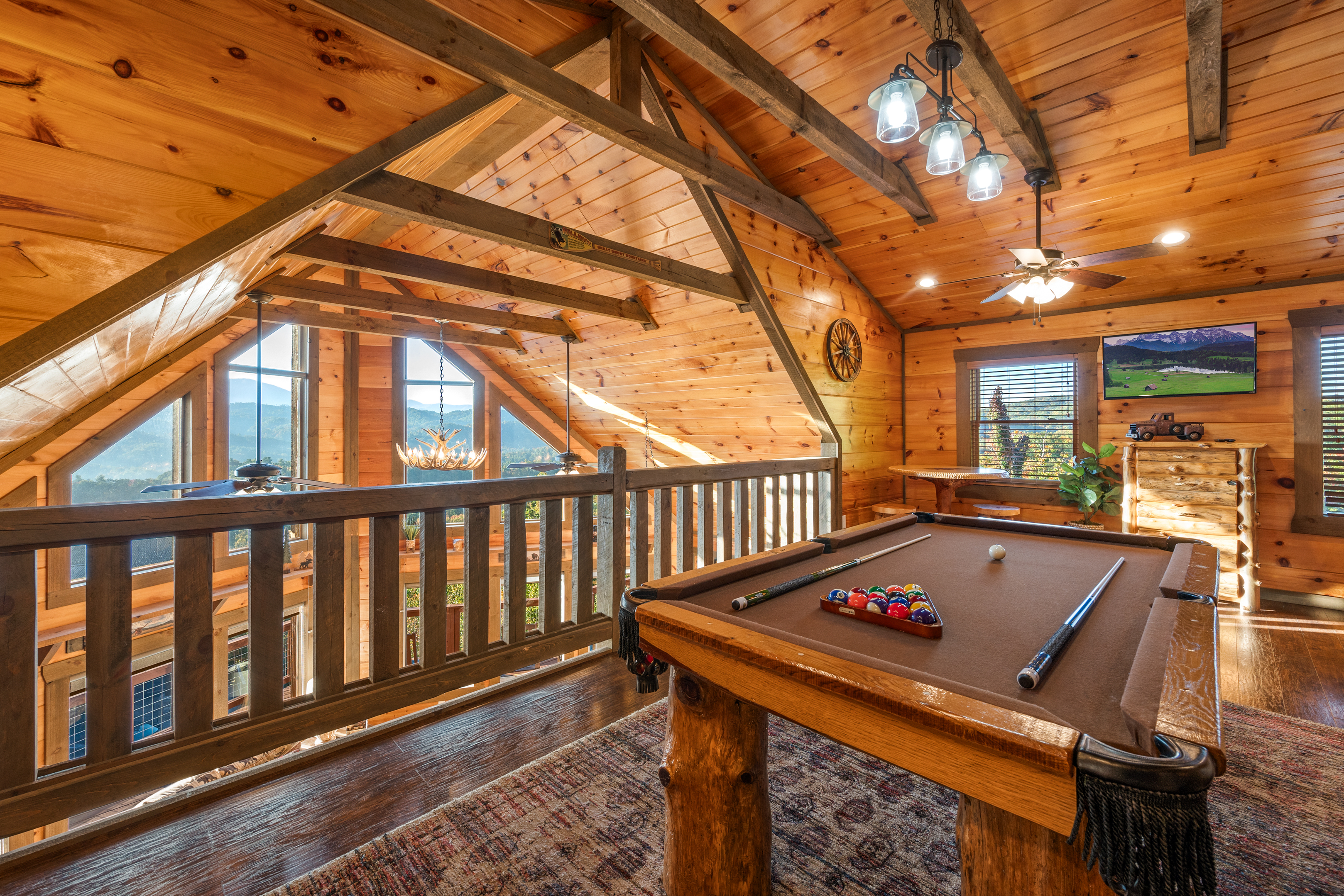 The open loft is a great hang out for kids and adults. Pool table, smart TV, and GIANT arcade.