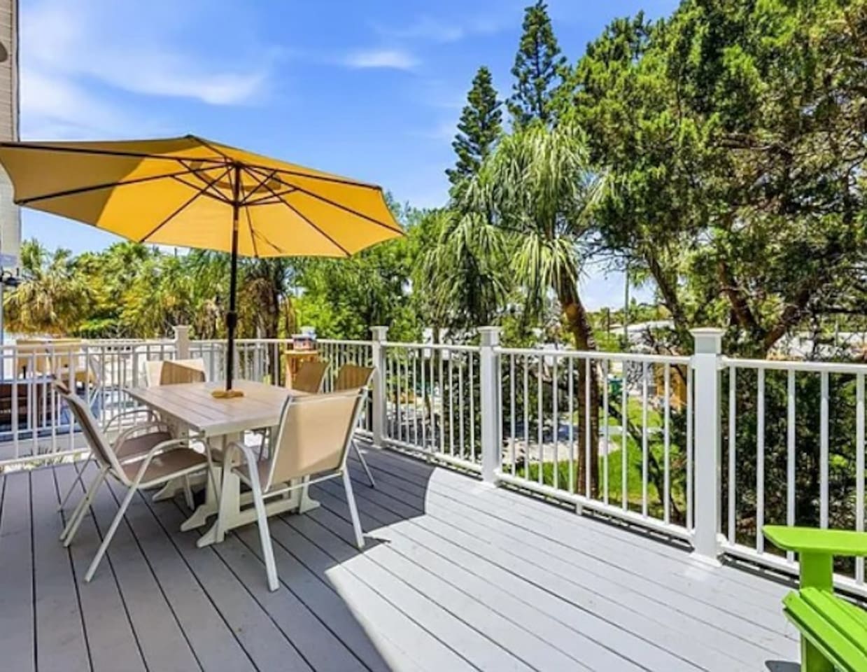 Gather on the spacious back deck for al fresco meals at the six-person dining table, shaded by a large umbrella. Enjoy a leisurely breakfast, share dinner with family and friends, or linger over drinks as you soak up the warm tropical surroundings.