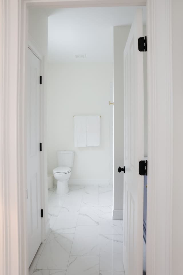 The spacious "sunrider room" features two queen beds, a spacious double-door closet, a full bath with a shower, smart TV and coastal photography. 