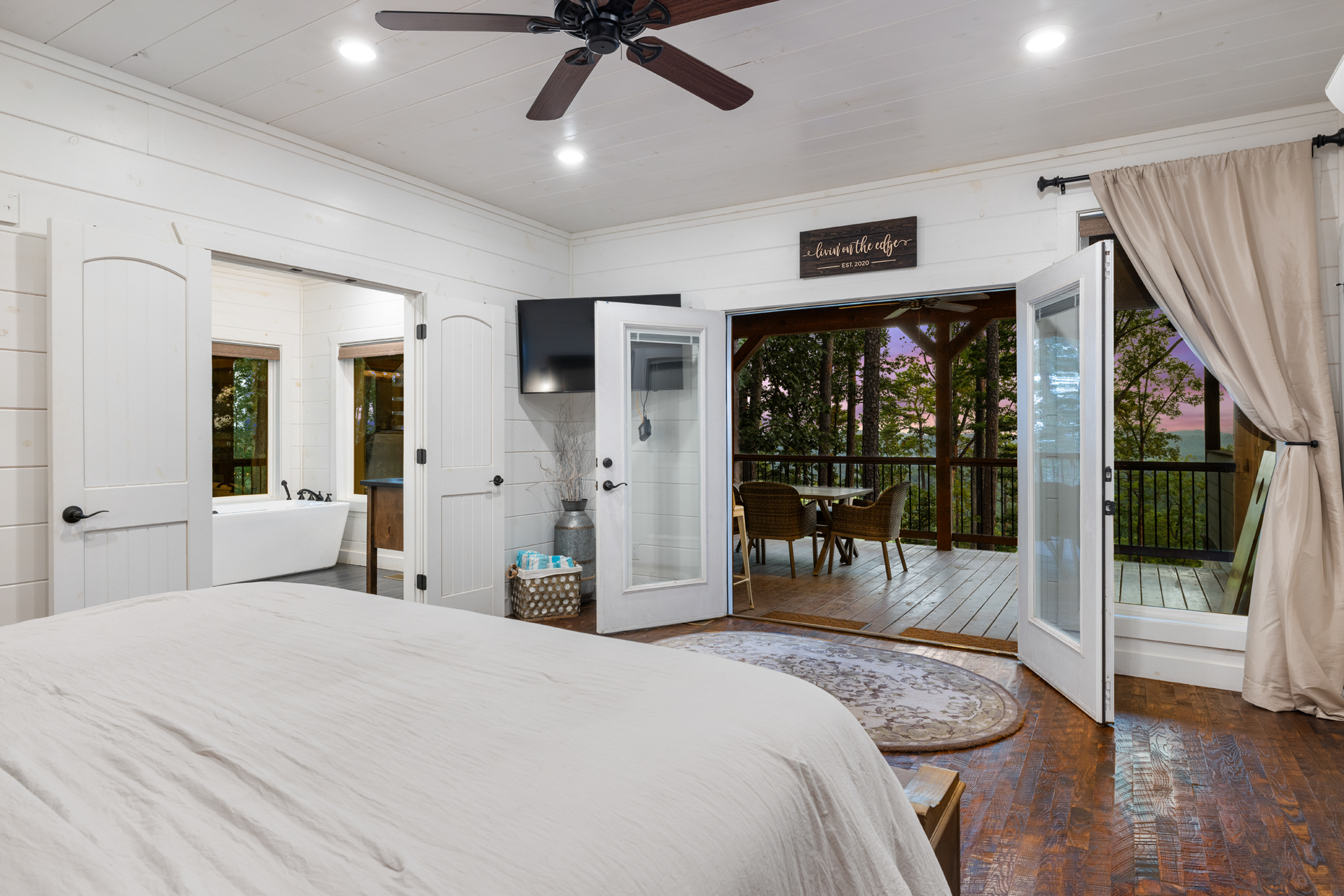 Peaceful bedroom retreat with private deck access and beautiful outdoor scenery