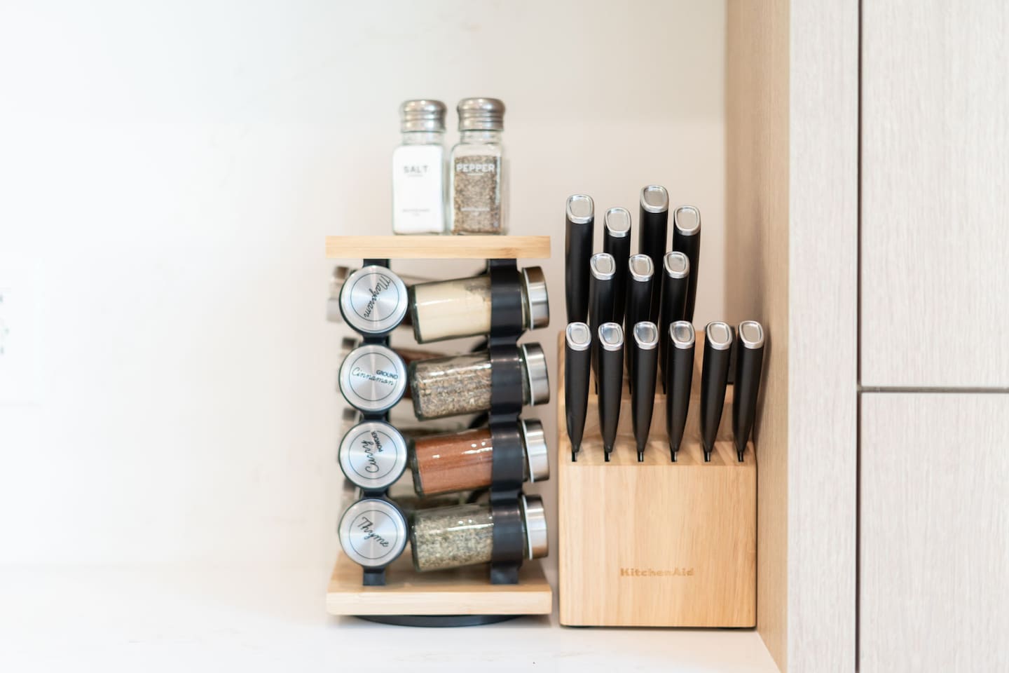 Spice rack and knife set ready for home-cooked meals.