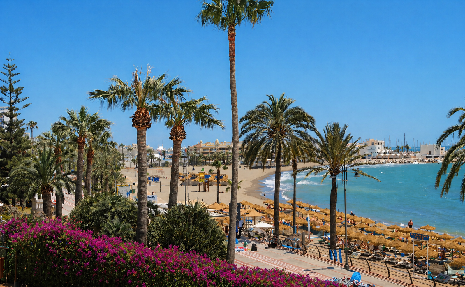 Torrebermeja Beach, Benalmádena – A vibrant seaside spot on the Costa del Sol, where palm-lined promenades, soft sandy shores, and sparkling Mediterranean waters create a lively and inviting coastal setting.