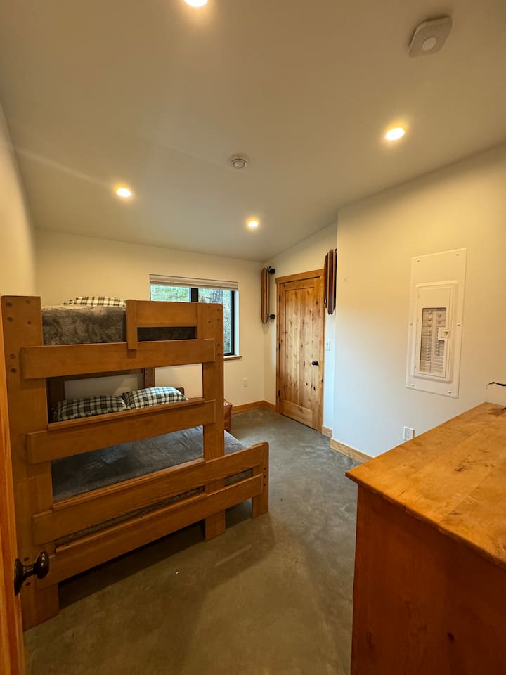 Guest bedroom with twin over full bunkbed and room darkening shades