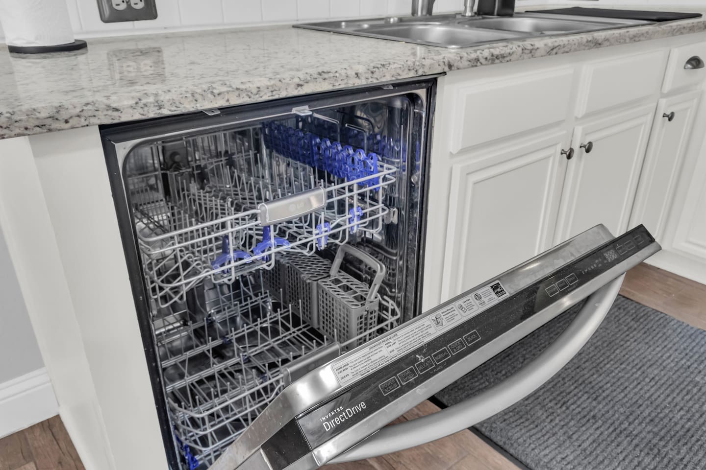 Full-size appliances including electric stove, microwave, dishwasher, refrigerator, and freezer for convenient daily use.