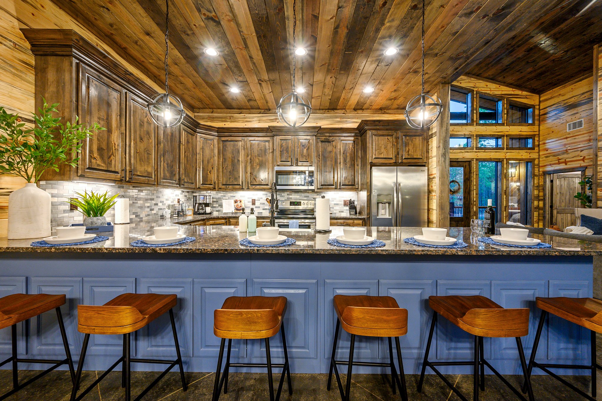 Cozy cabin kitchen with granite island, and plenty of seating area
