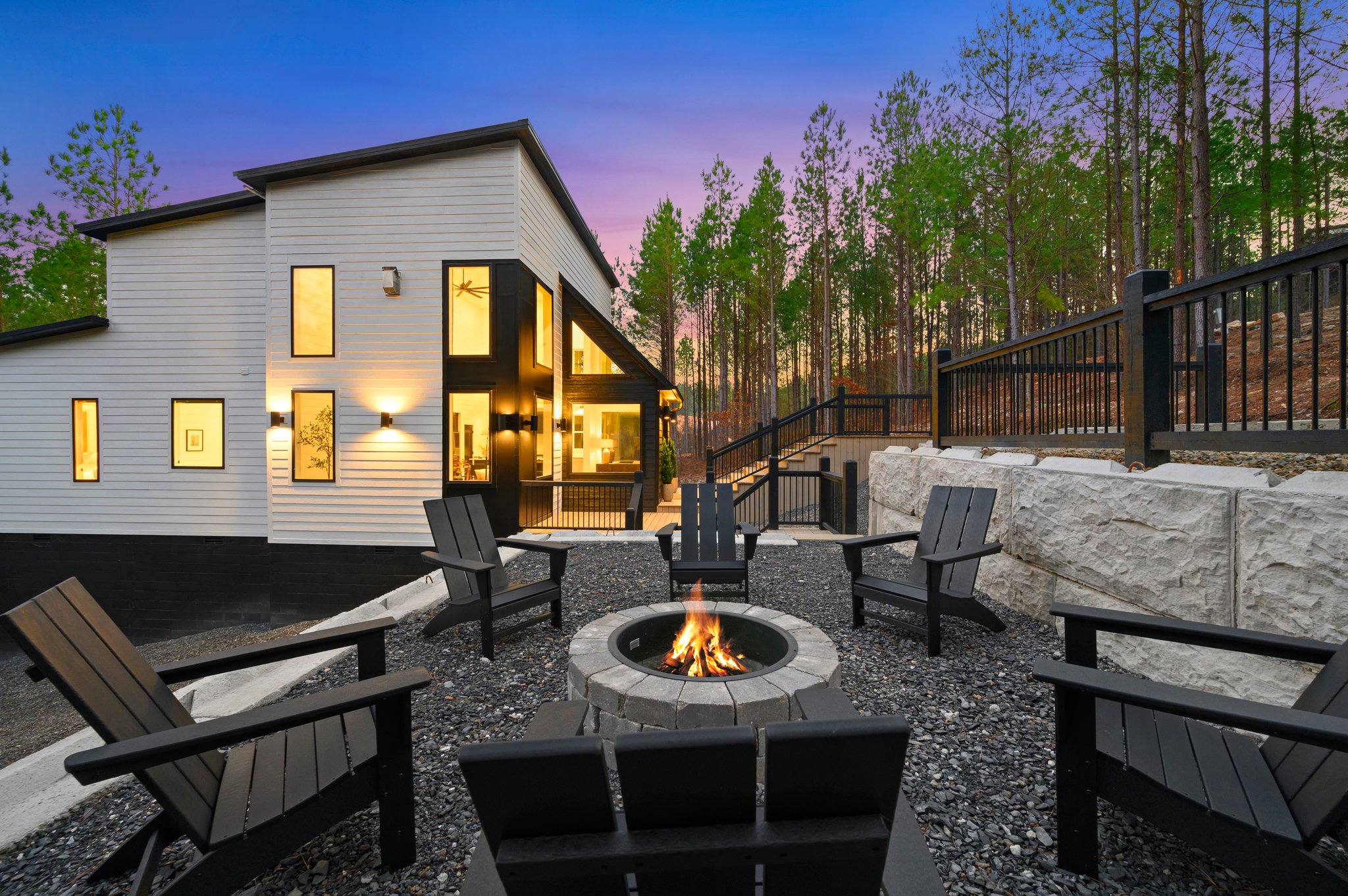 Adirondack chairs encircle the firepit, creating the perfect spot for s’mores and conversation.