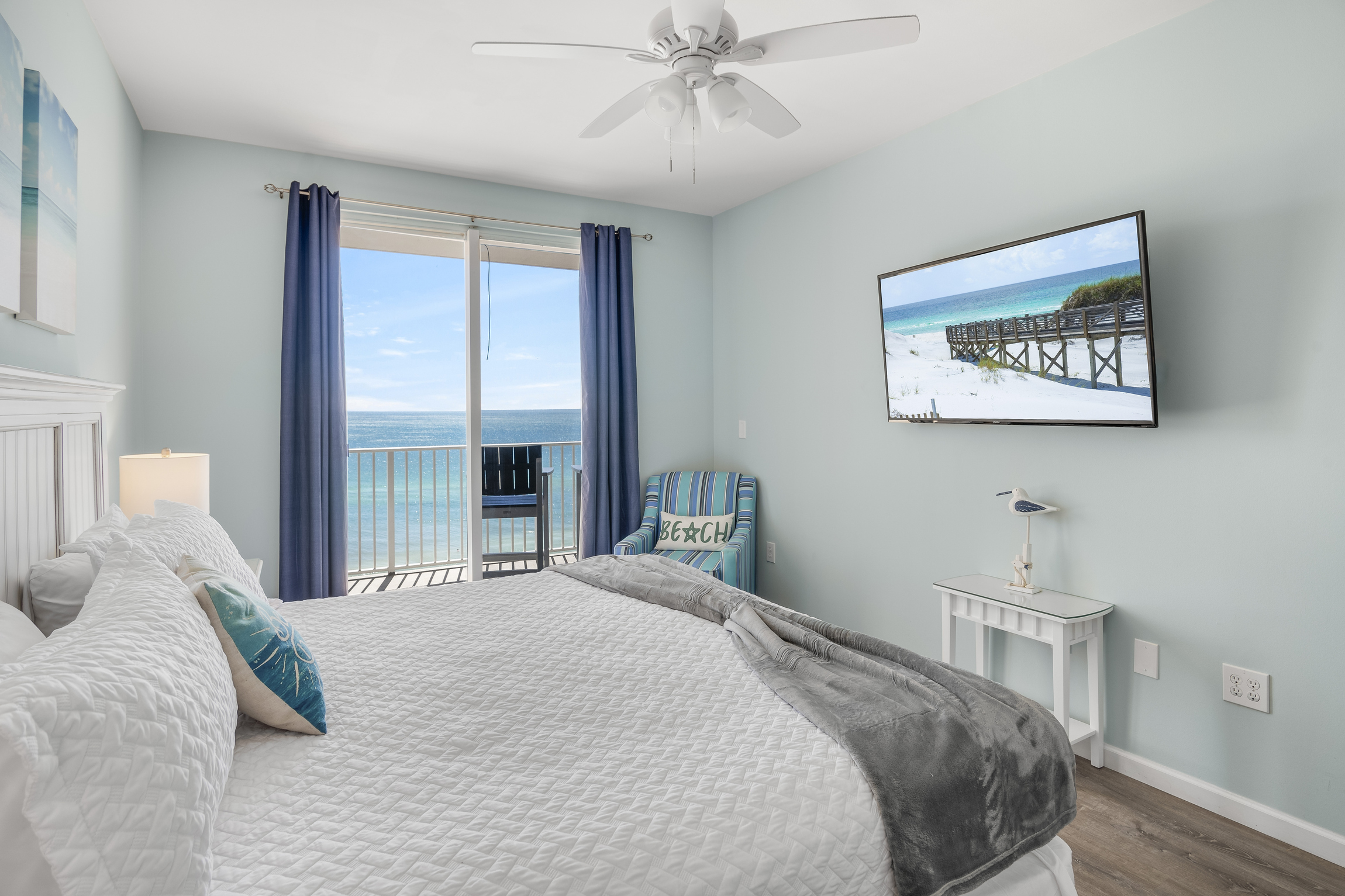 Spacious master bedroom features a King bed, Gulf views, balcony access, SMART TV w/ cable access, remodeled bathroom with walk in shower, and large closet.