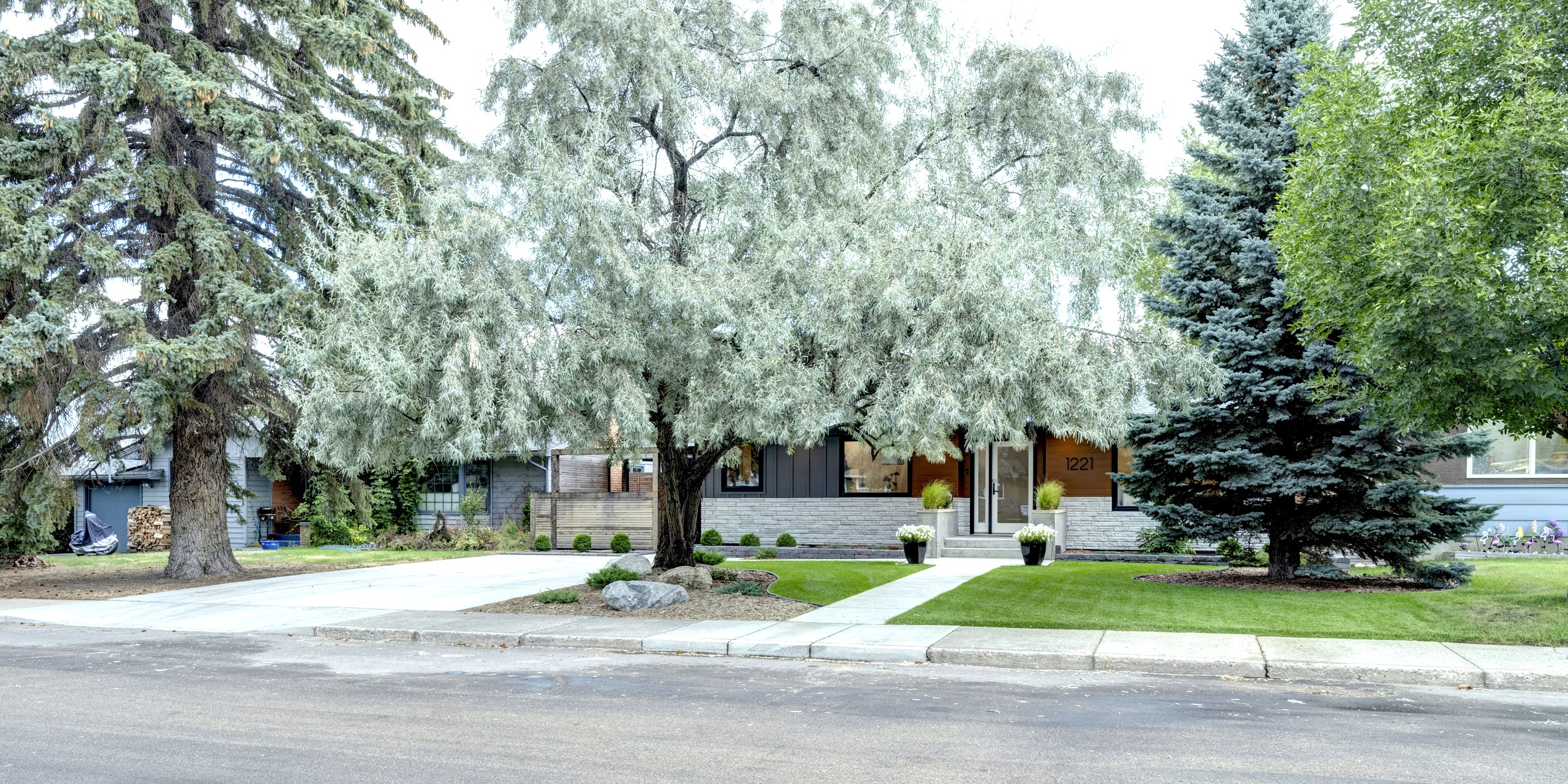 Street view of the home with ample street parking in front in a quiet, established residential area.