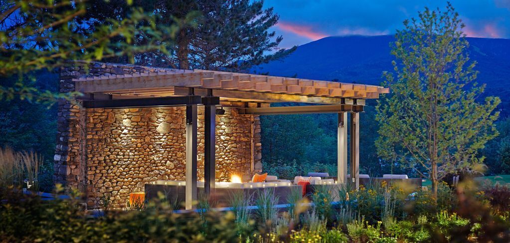 Outdoor seating and firepit off The Roost lawn