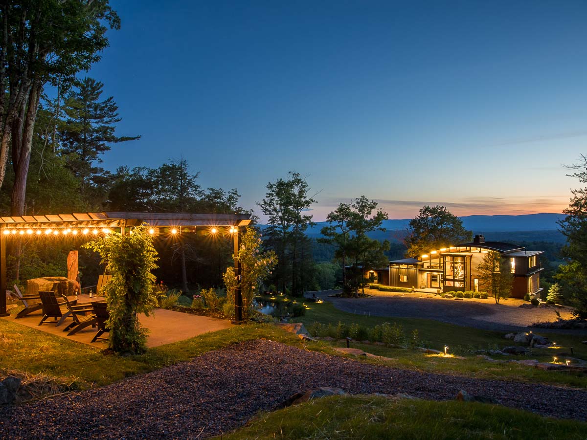 der Biergarten at night &mdash; the pergola above the house, the Berkshires ridgeline beyond &mdash; Sunset Falls