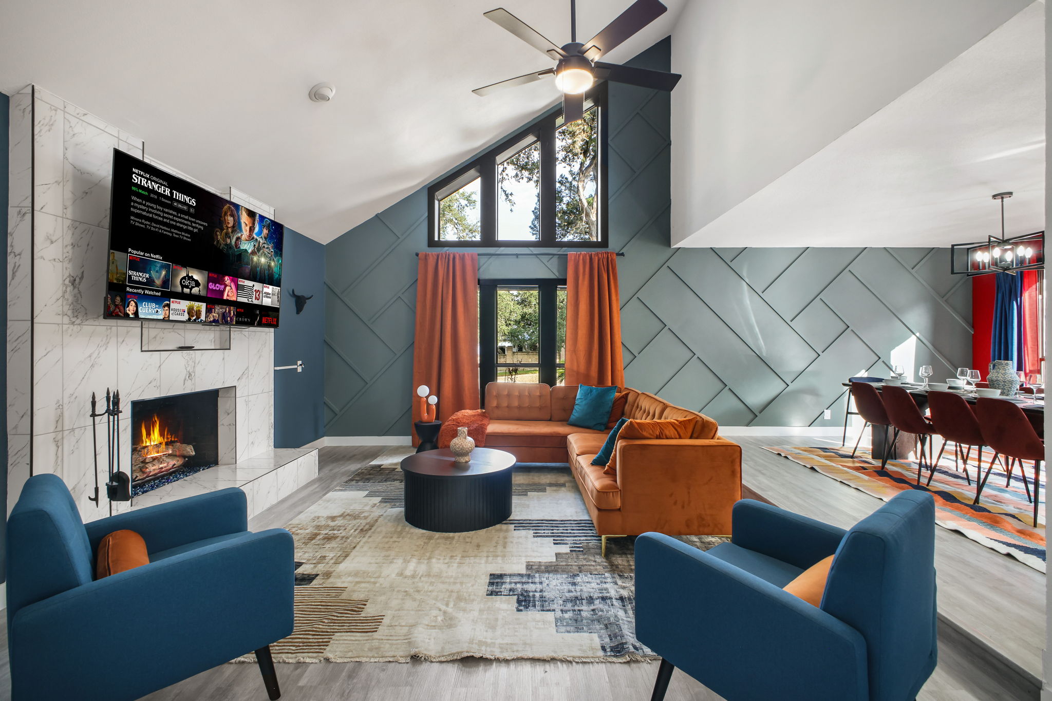 Natural light and a geometric accent wall create a striking backdrop.