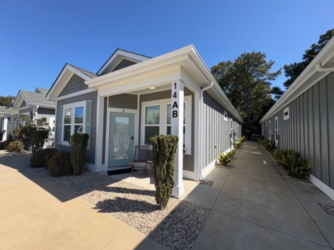 Side exterior view with private entrance walkway