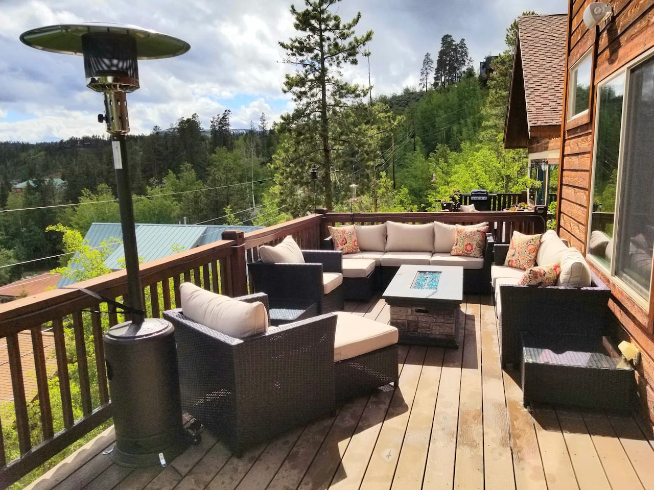 Amazing views and an abundance of seating on the upper deck facing the lakes. Overhead heater and fire table