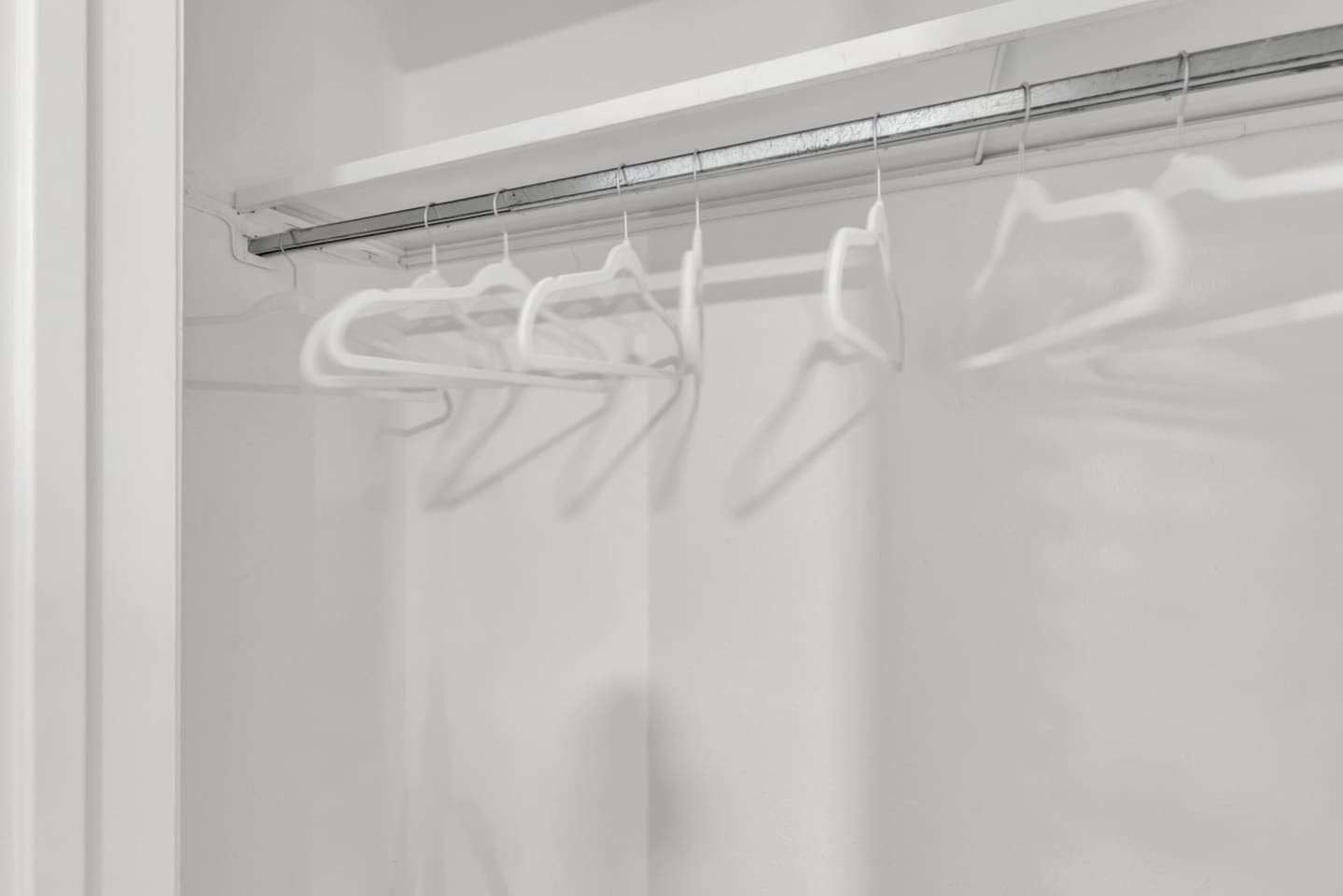 Spacious closet with plenty of hangers and clothes storage, ideal for unpacking and settling in during long-term stays.