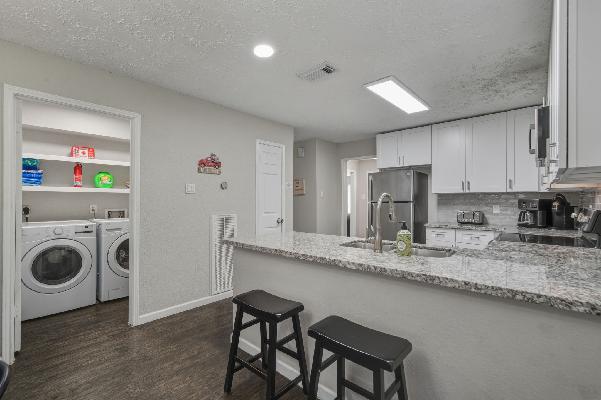 Gather around the countertop for coffee, cocktails, or quick bites.