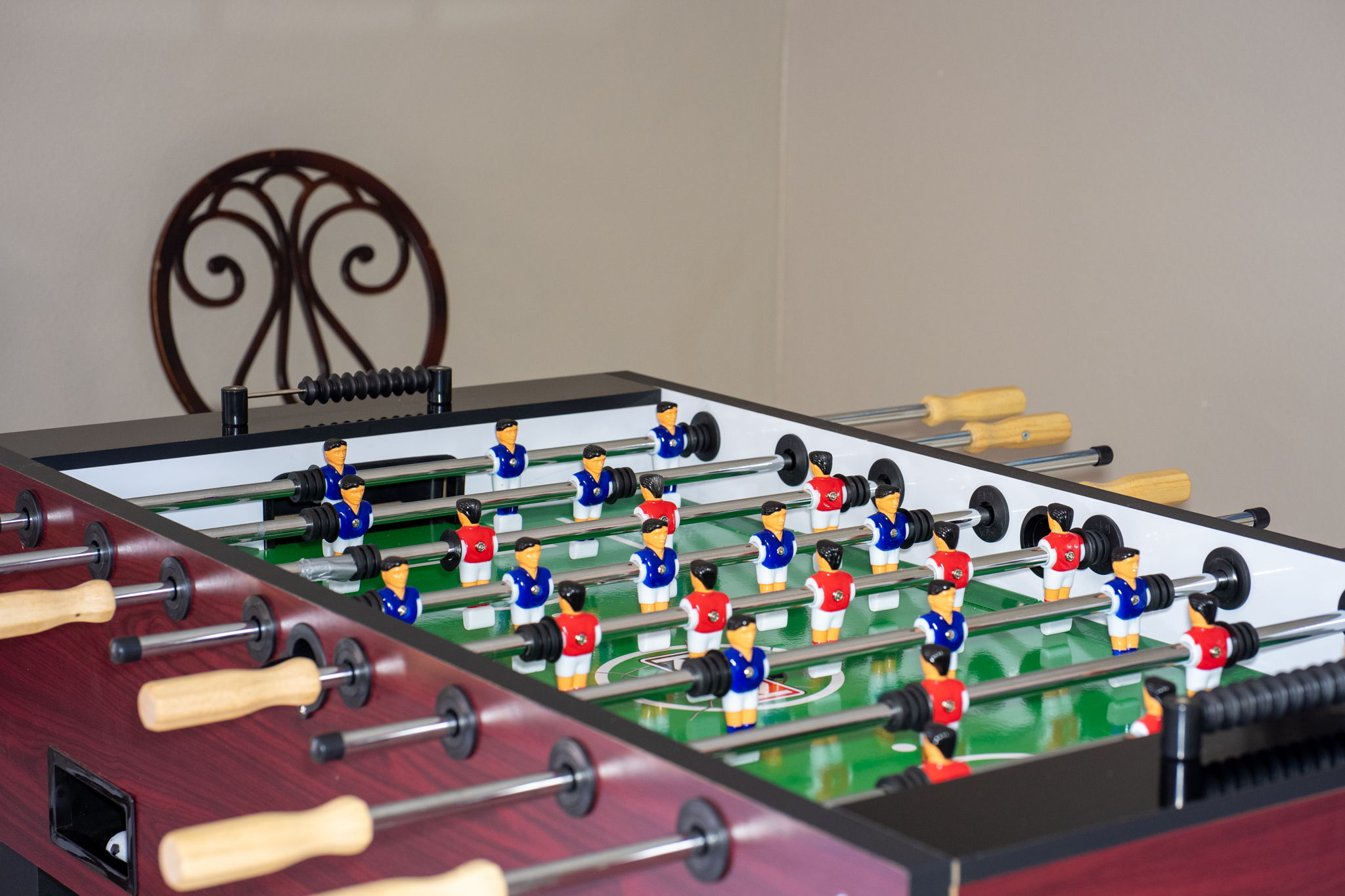 Bring the whole crew together in this spacious game and dining area featuring tile floors, stylish décor, and games that’ll keep everyone entertained.