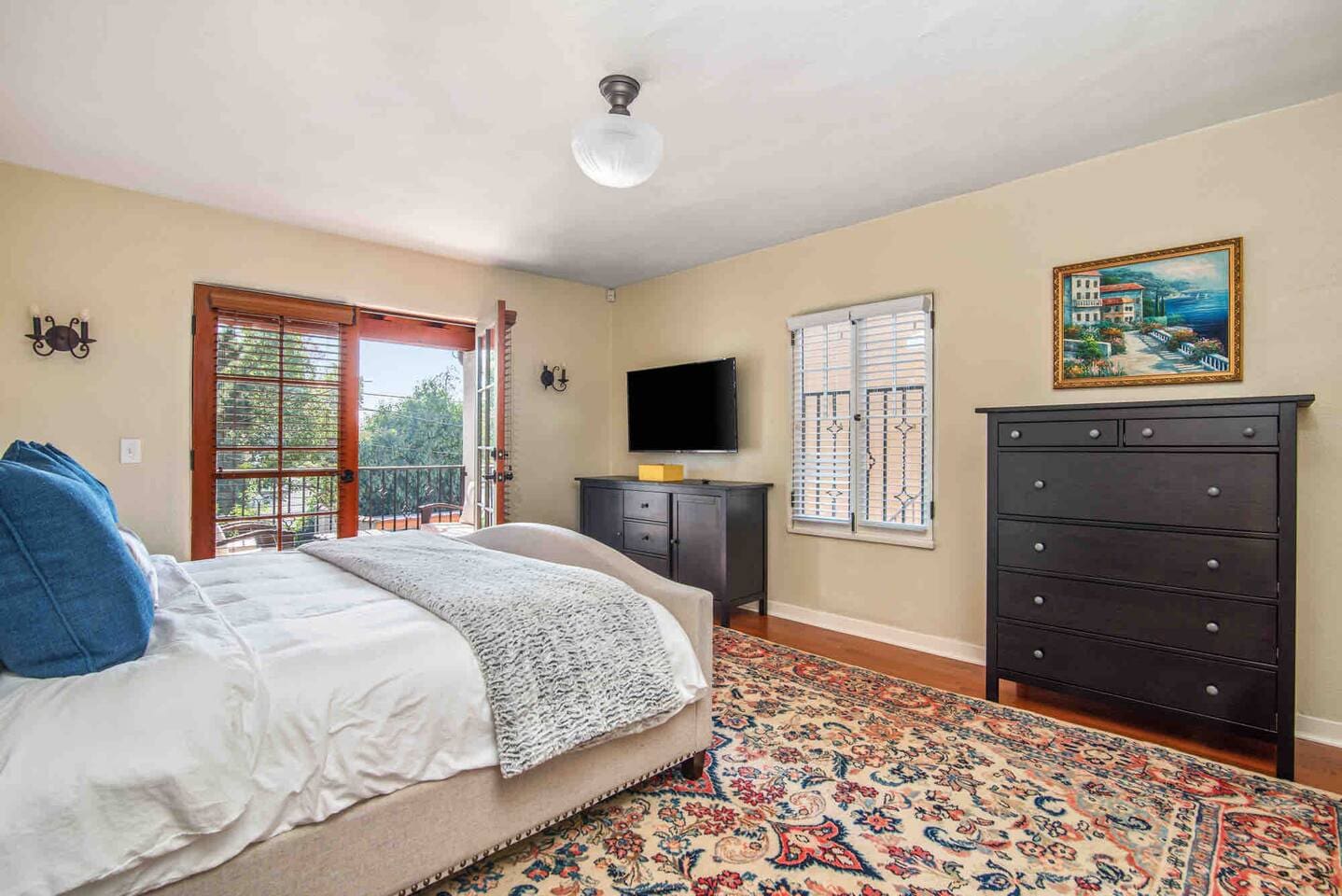 The primary bedroom is located above the back of the home with views of the backyard. 
