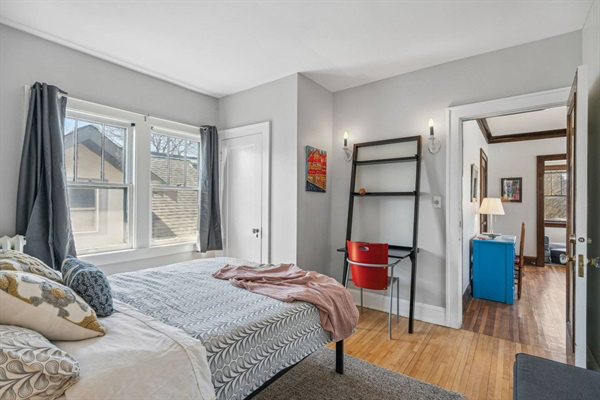 Cozy queen bed, desk and office chair in the Butterfly Room!