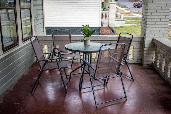 Start your day on the front porch with a table for four—perfect for coffee or a slow morning