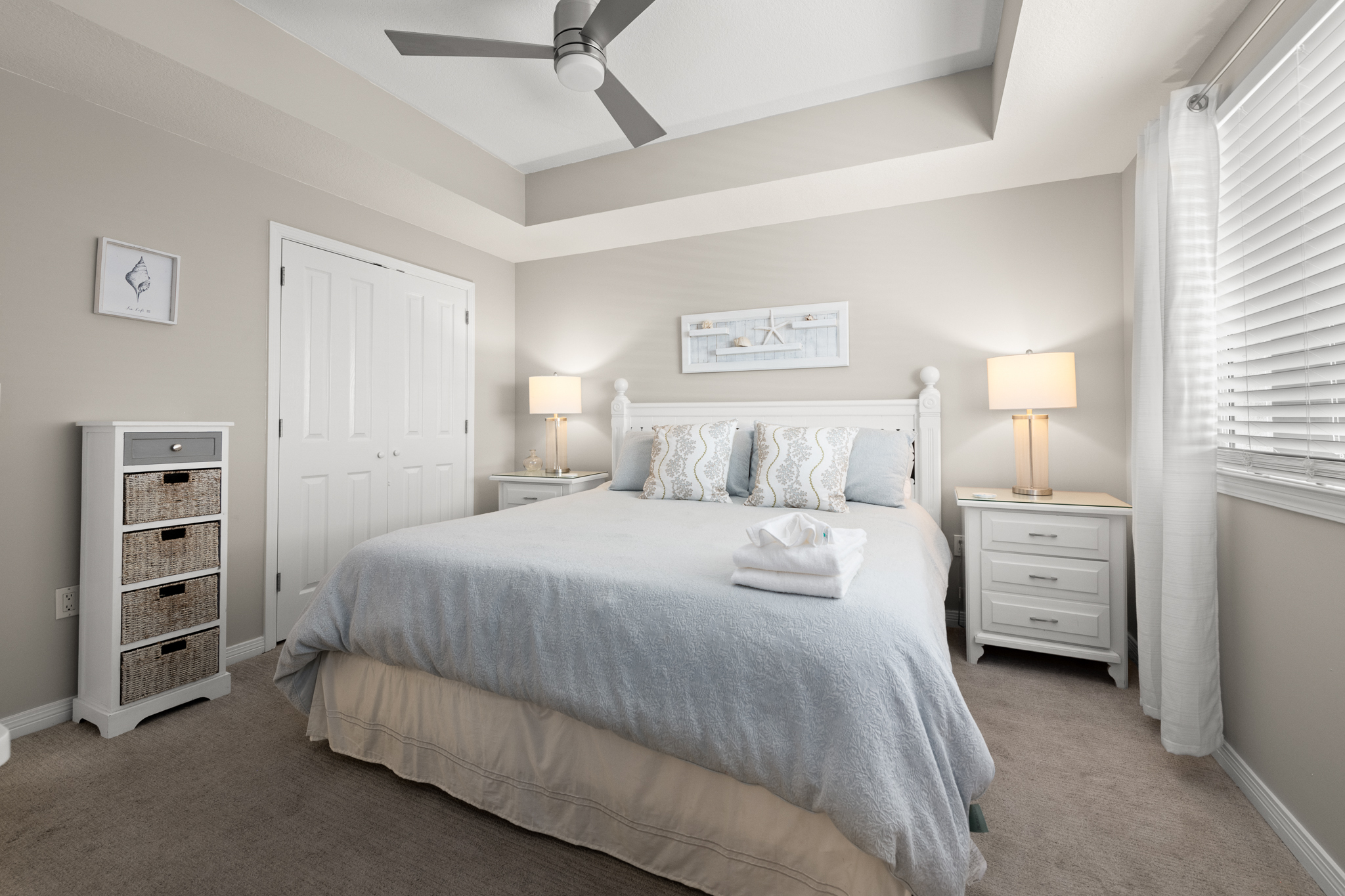 King-size bed dressed in crisp linens for a comfortable sleep.