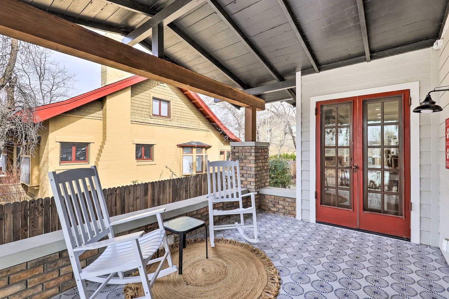Wide French doors welcome you home, framed by classic craftsman charm.