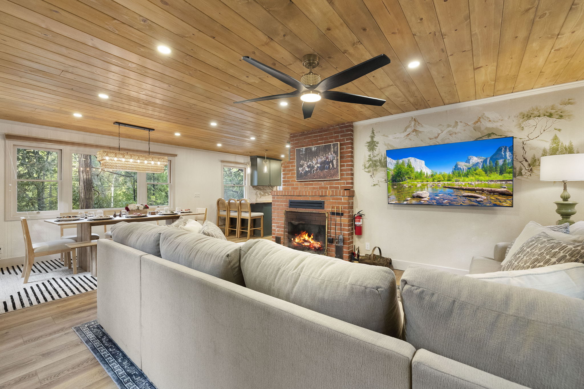 Open concept living with a combined living room, dining room and kitchen. Just enough division to feel like separate spaces and the perfect amount of openness to all be together.