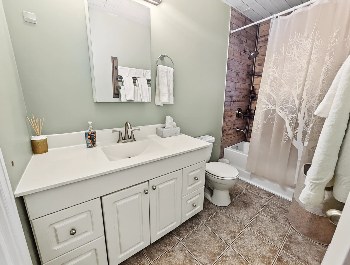 Full bathroom with tub and shower