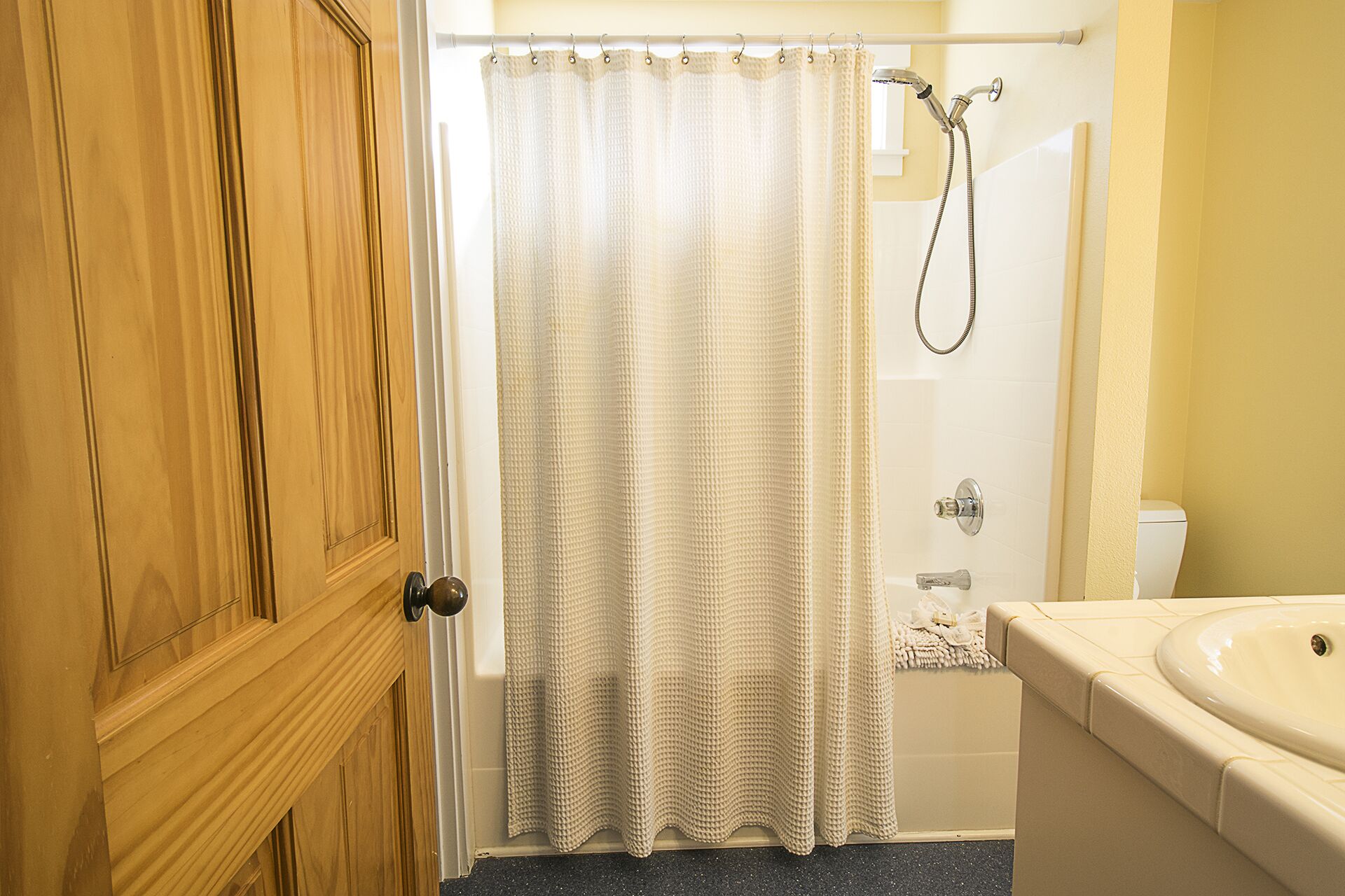 Unwind in style — the master bath offers a soaking tub, convenient handheld shower, and a walk-in closet for all your essentials.