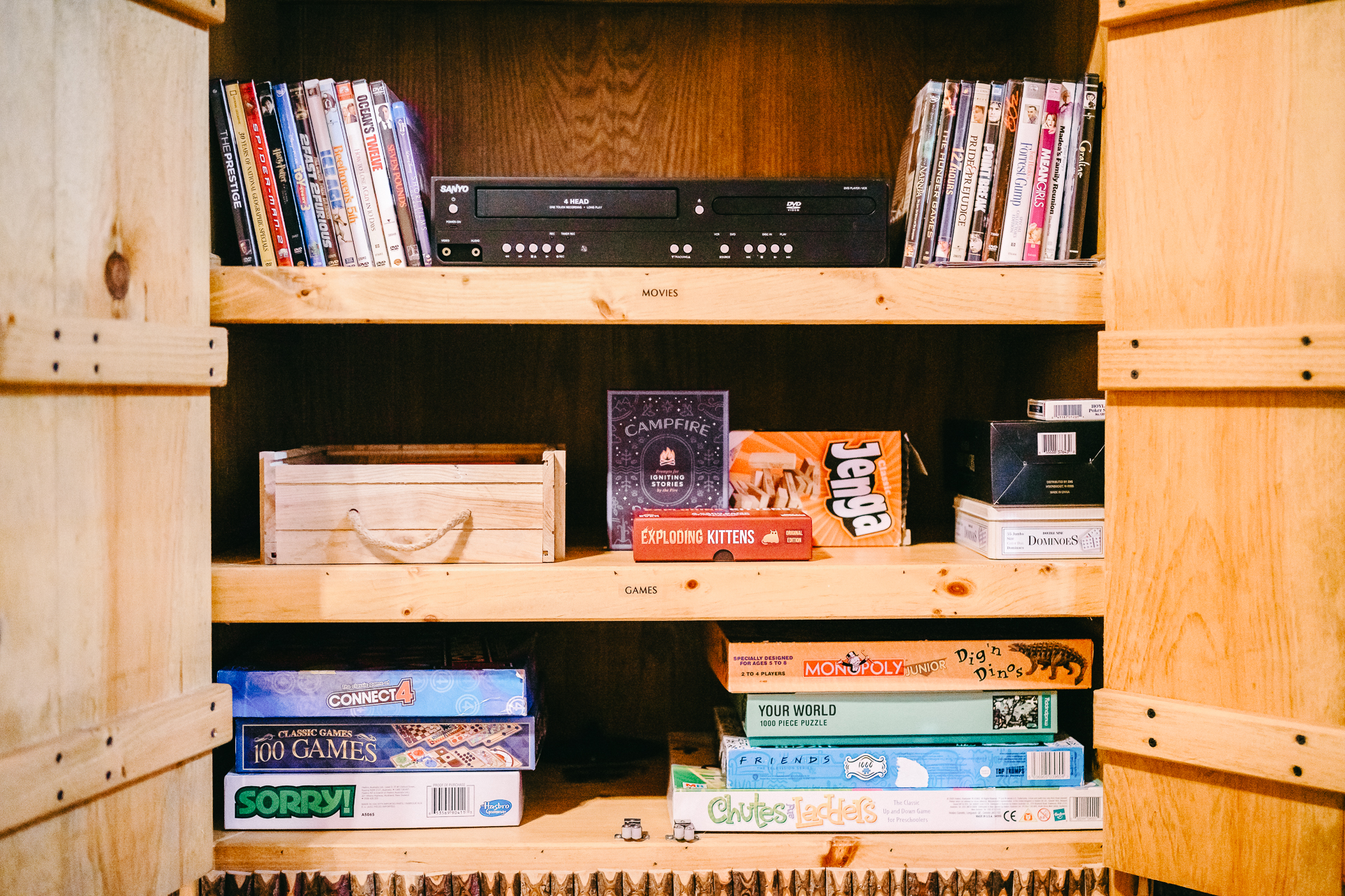 Entertainment cabinet with nostalgic collection of games and DVDs