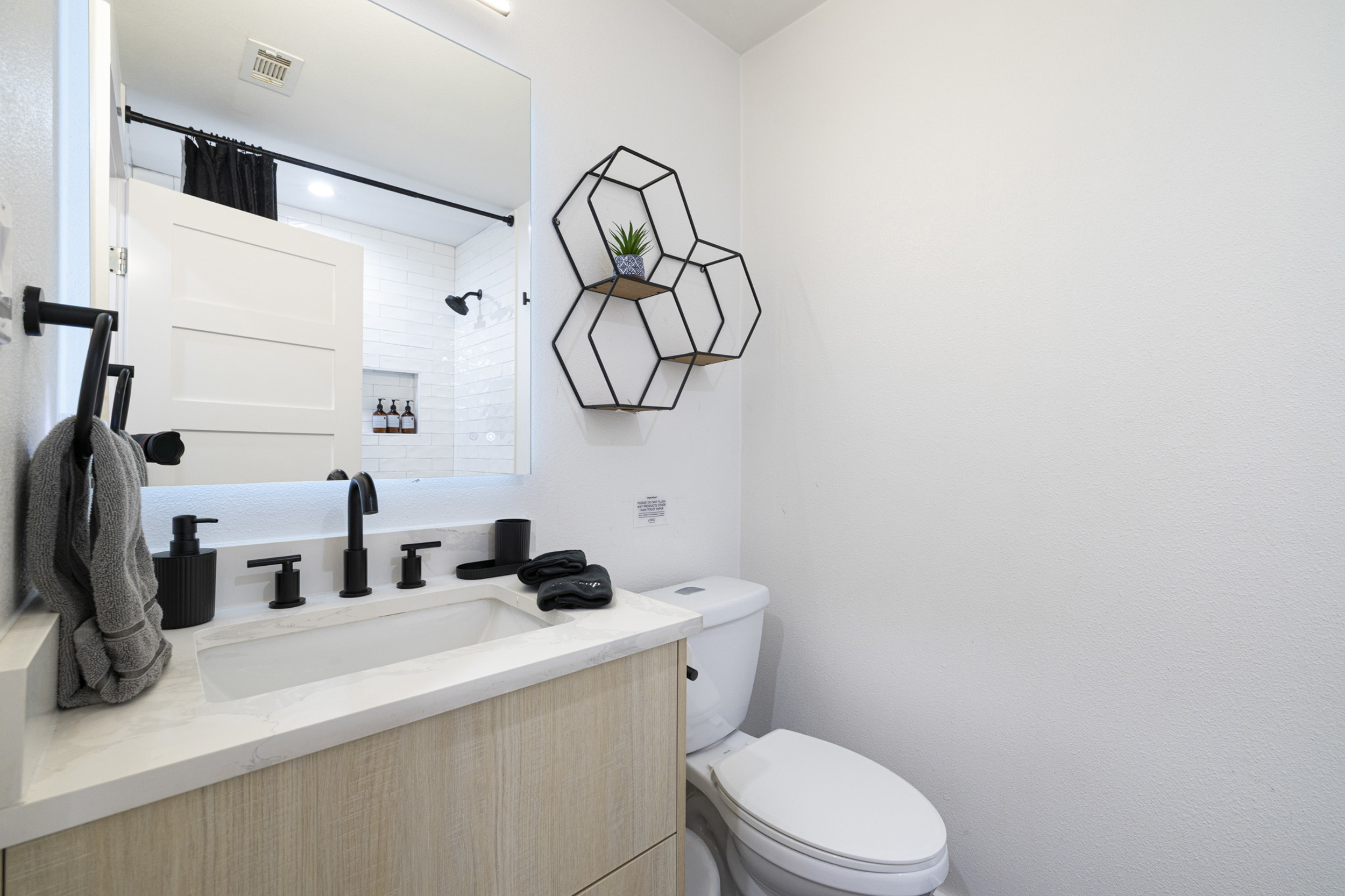 Stylish fixtures and modern decor await your refresh in this chic retreat!
