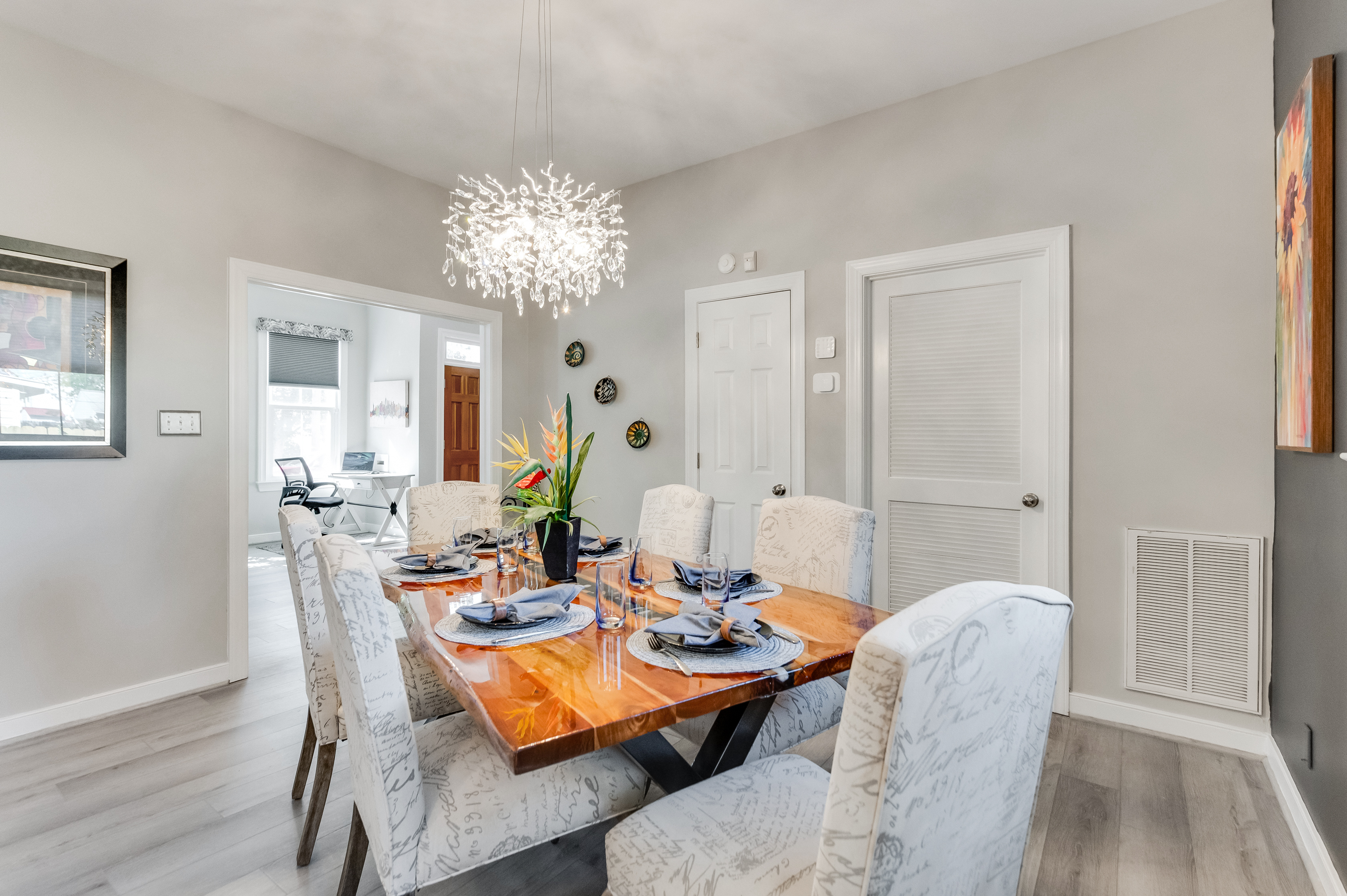 Dining Room: Elegant dining area with a stunning chandelier, perfect for gatherings and feasts!