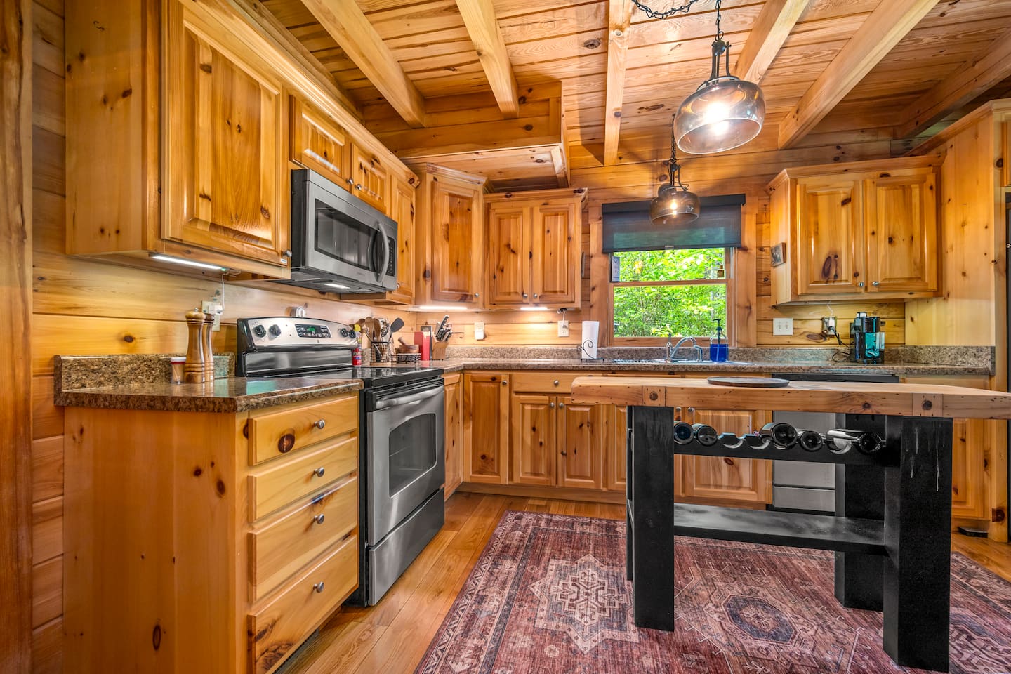 Fully equipped kitchen with modern appliances, and plenty of counter space for cooking and gathering.