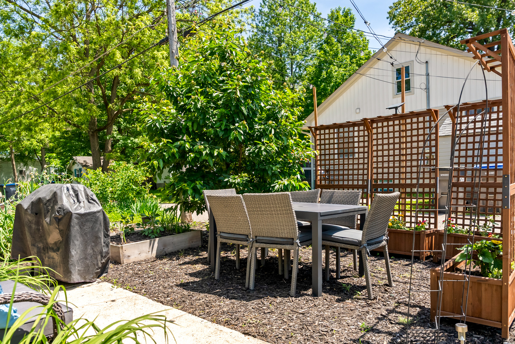 Room for the whole crowd to spread out! In addition to our main stone patio, the property features a secondary garden patio with an extra dining table and a second gas grill—making multi-family cookouts a breeze.