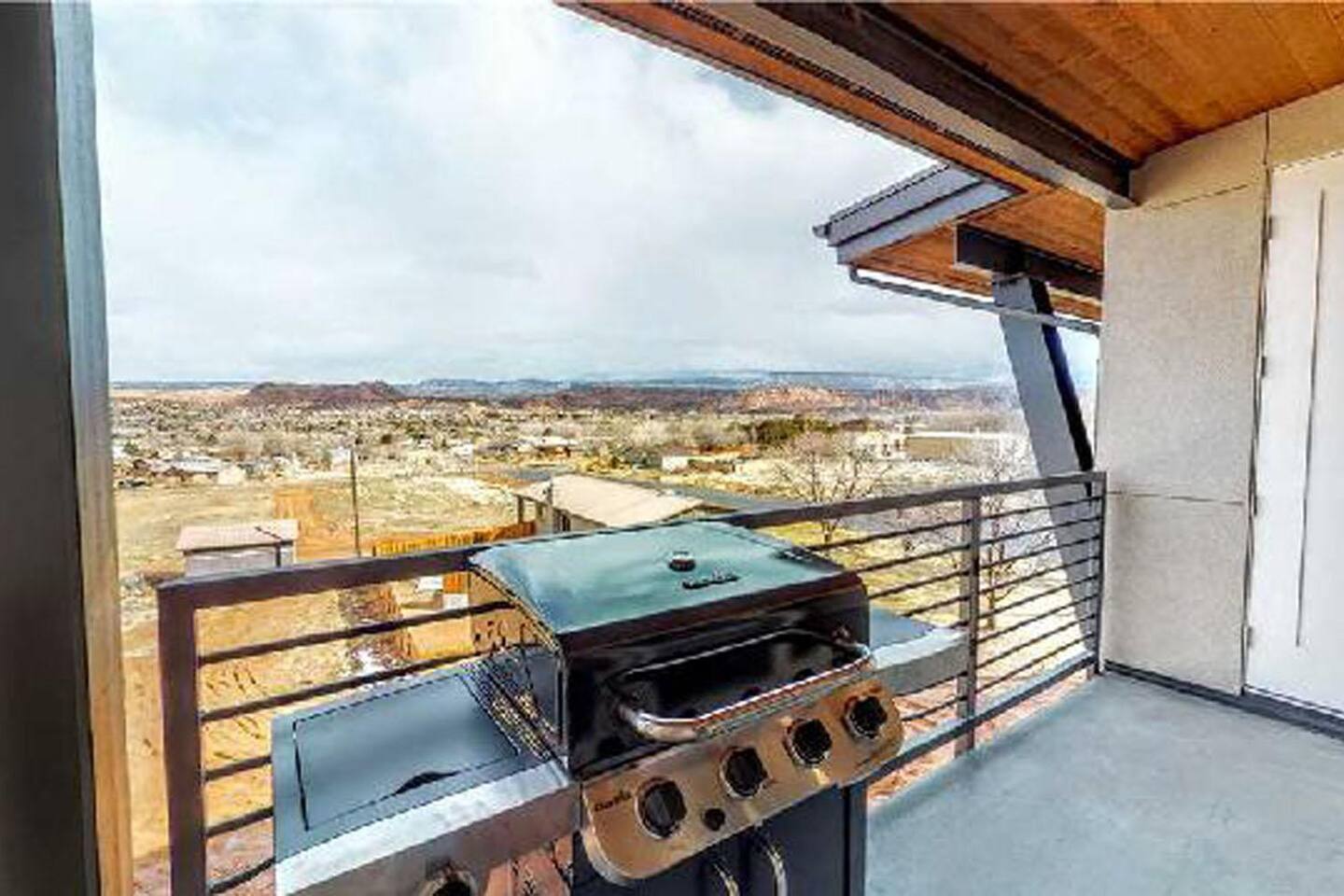 Covered family room balcony with amazing view and BBQ