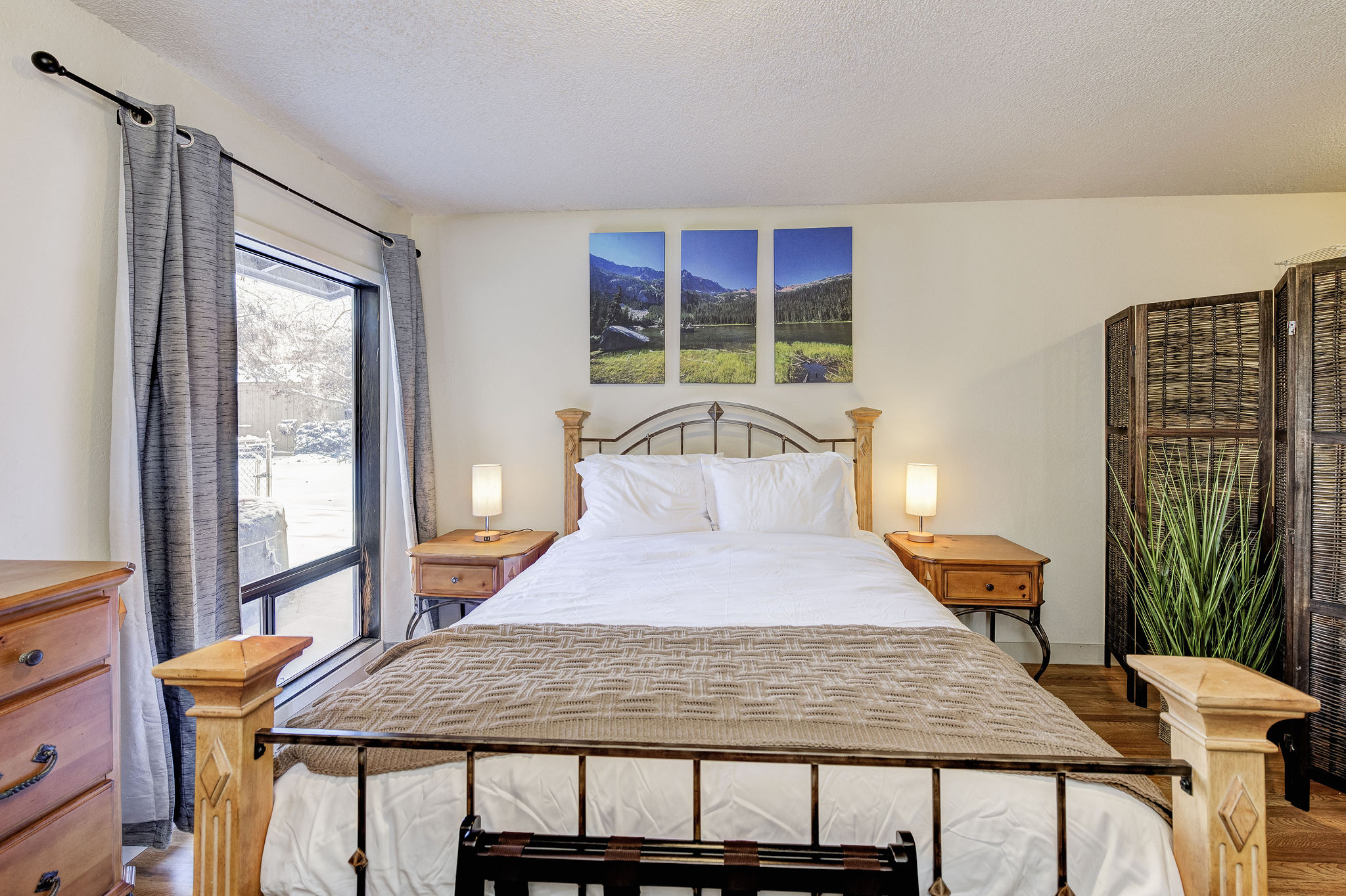 Queen bedroom with large closet and located next to laundry room.