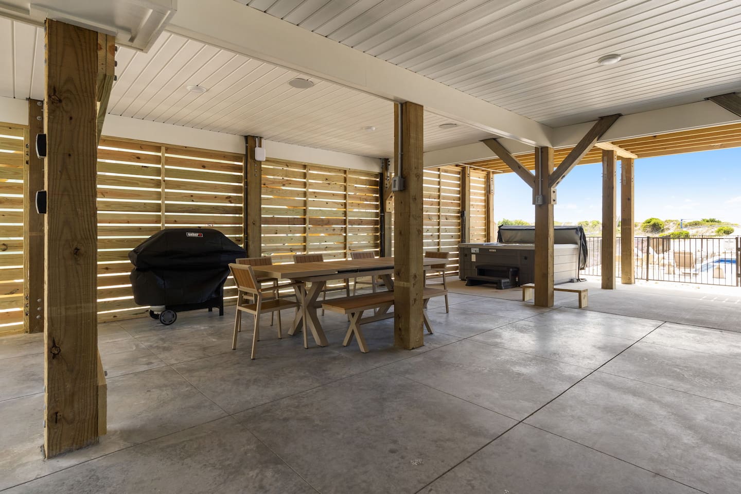 The fun continues on the ground level. Gather around the outdoor dining table for meals together, fire up the 5-burner propane grill for a family cookout, relax in the hot tub, or spend the afternoon enjoying the private pool.