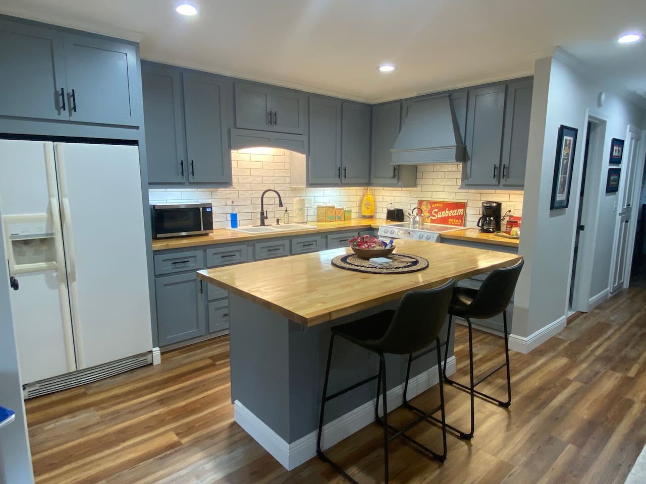 Beautiful kitchen with everything you need to cook a meal if you so choose. Coffee bar with all the fixings and snacks provided. 