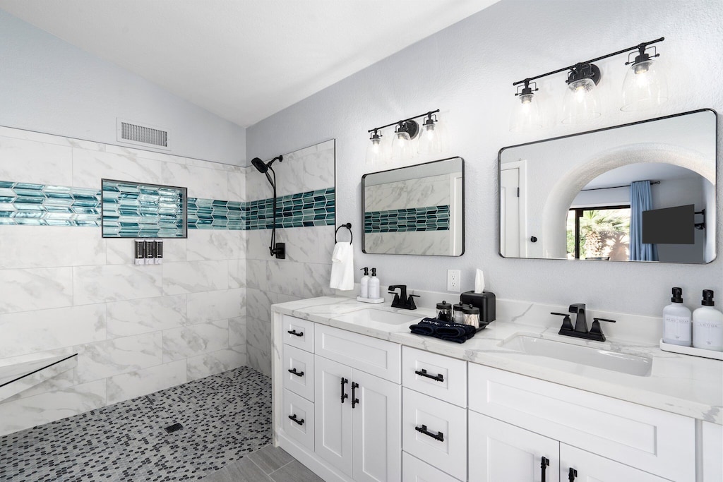 Another great angle of the primary bathroom! Enjoy a Complimentary basket of toiletries: bar soap, toothbrush, toothpaste, deodorant, tampons, pads, and more!
