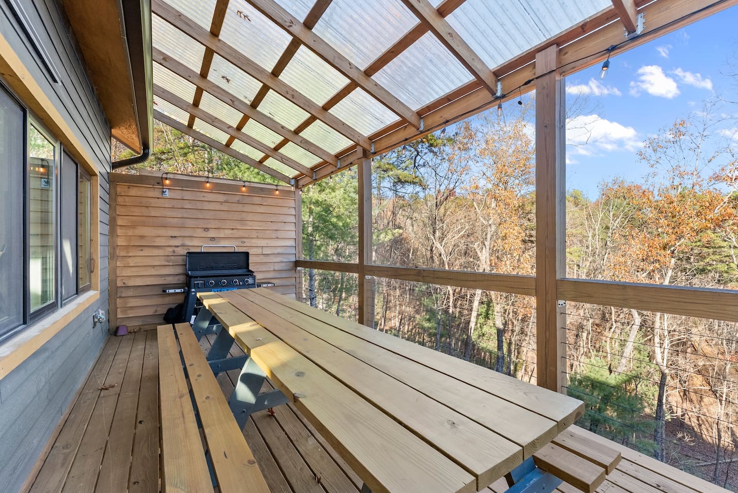 A large table and a grill—perfect for outdoor meals and gatherings.