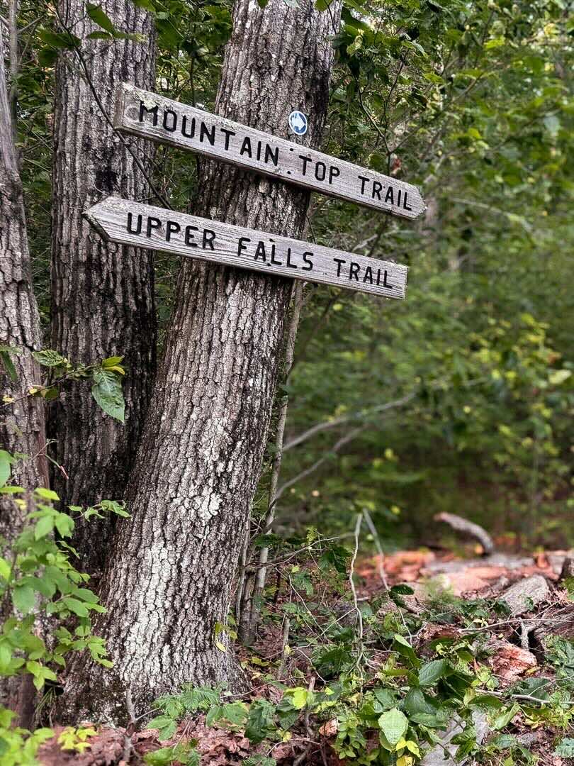 Hand-cut Mountain Top and Upper Falls trail sign on Woodruff Mountain at Sunset Falls Estate