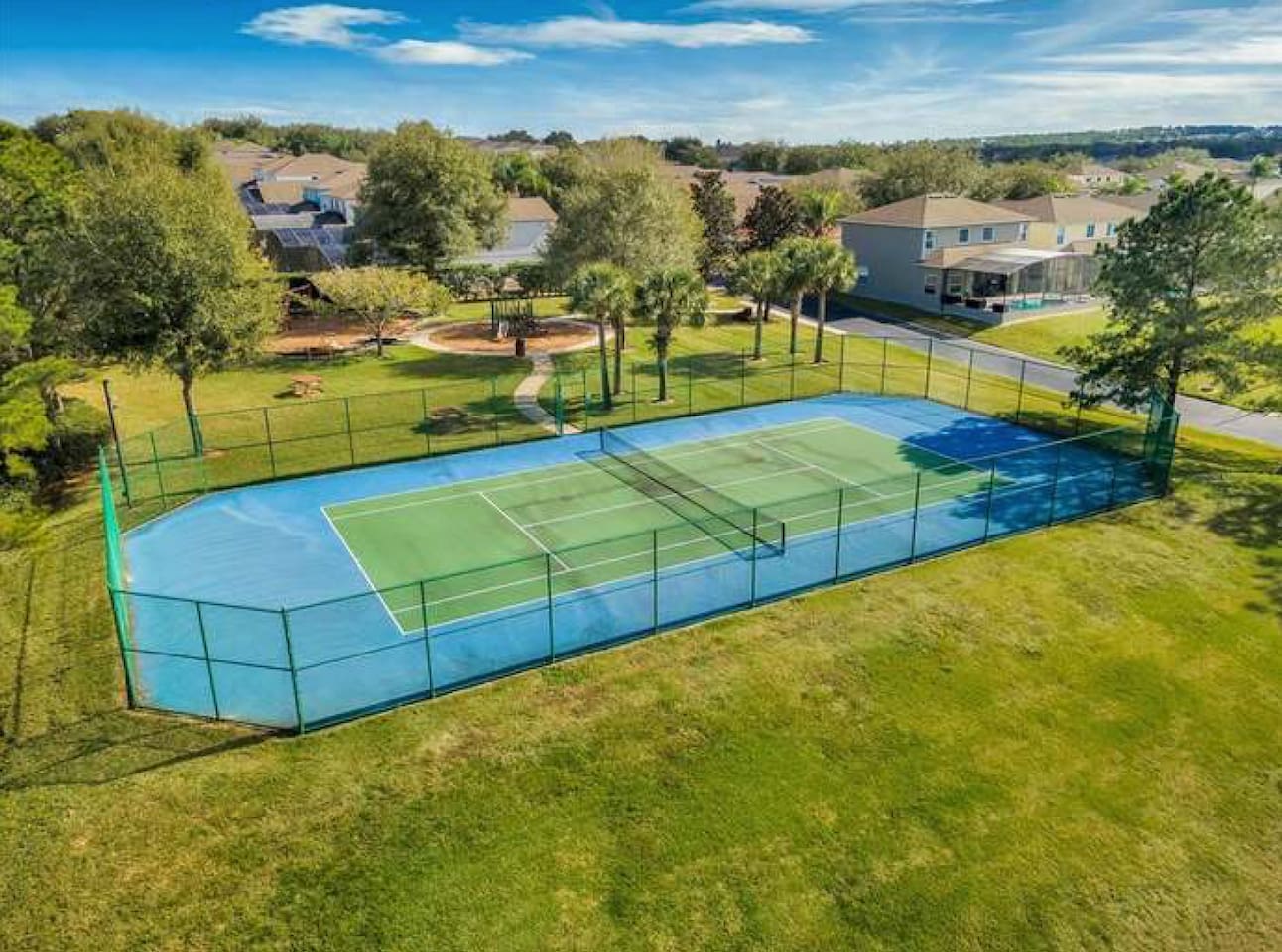 Community tennis court ~500 feet from the home