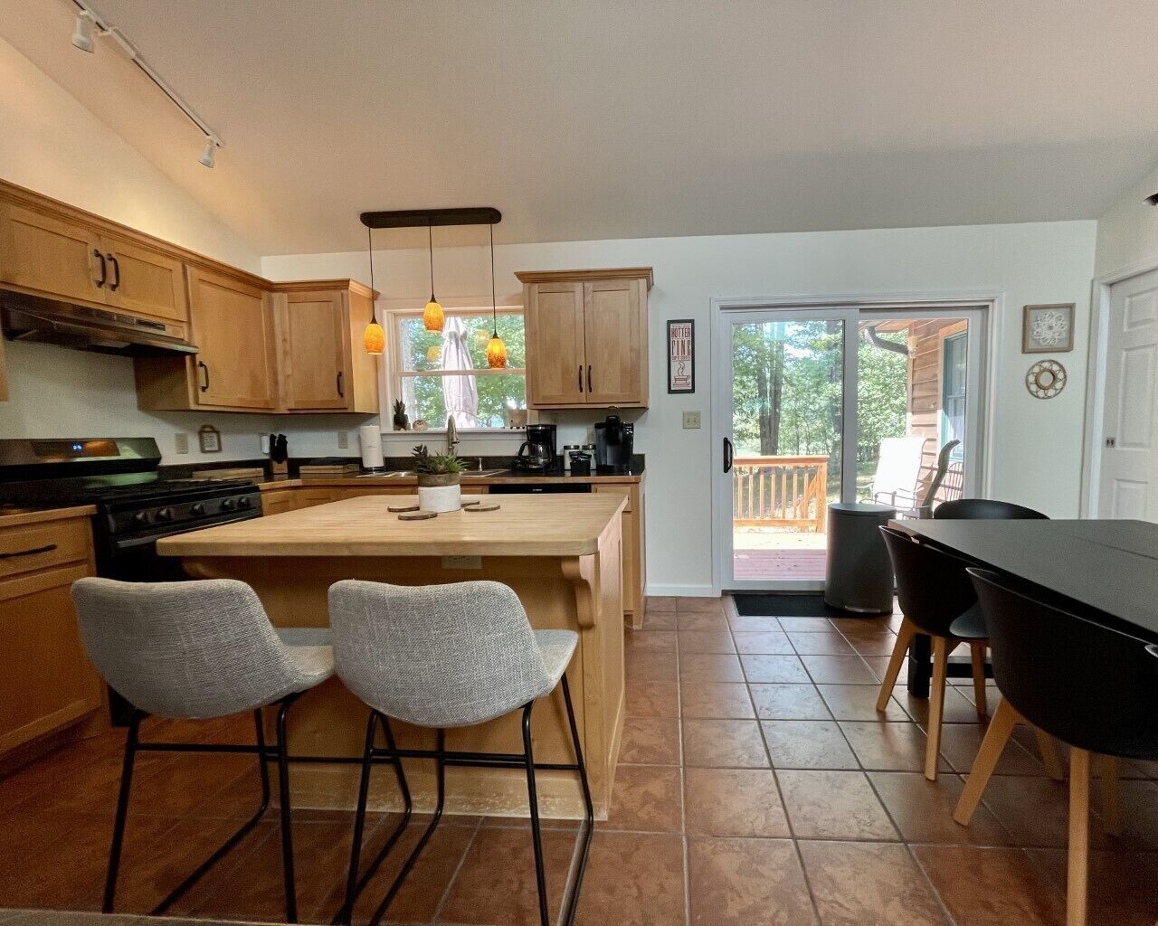 Breakfast bar seats two. Sliding doors to back porch