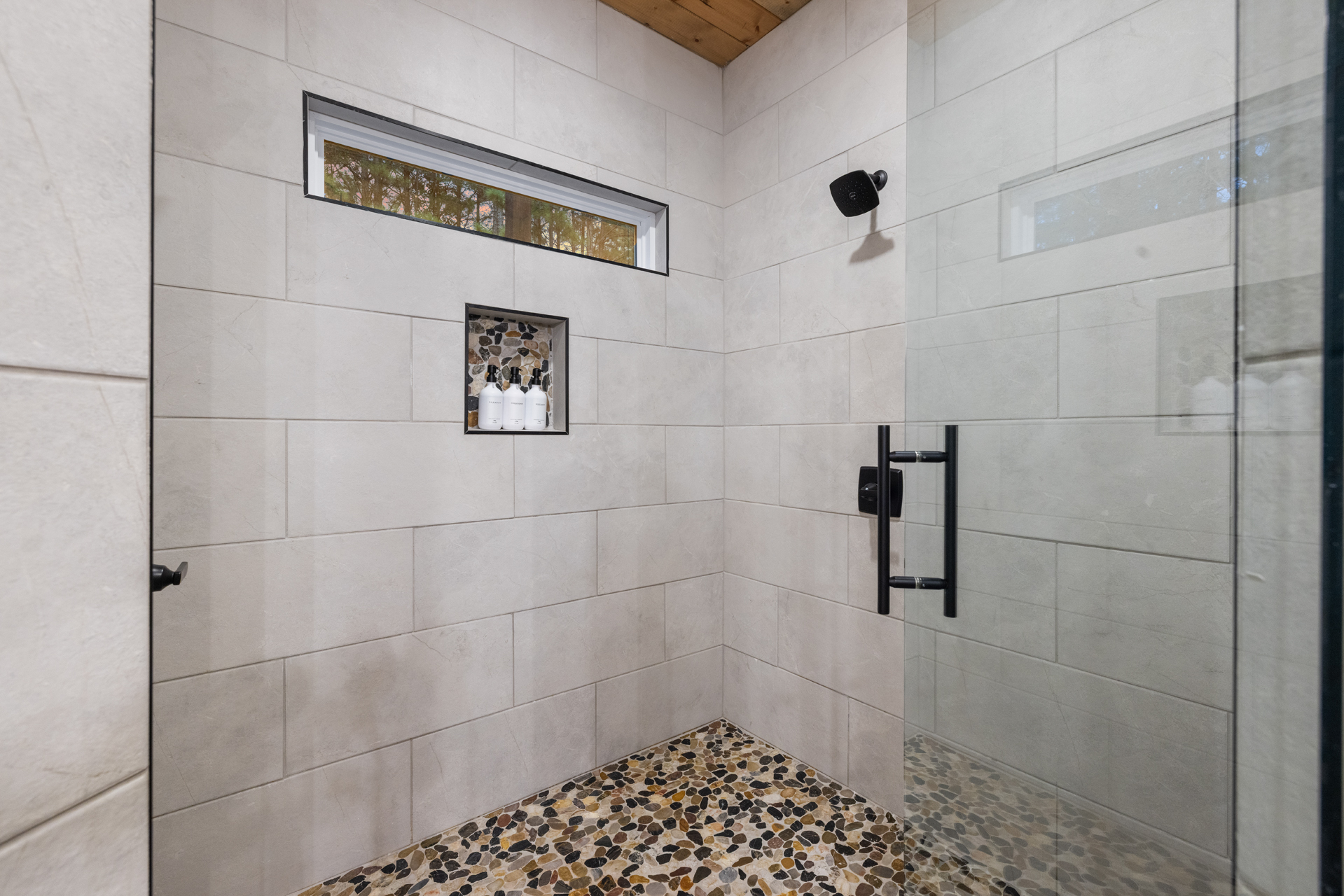 Rinse off the day in the oversized walk-in shower, another little touch that makes the ensuite feel more like your own private spa.