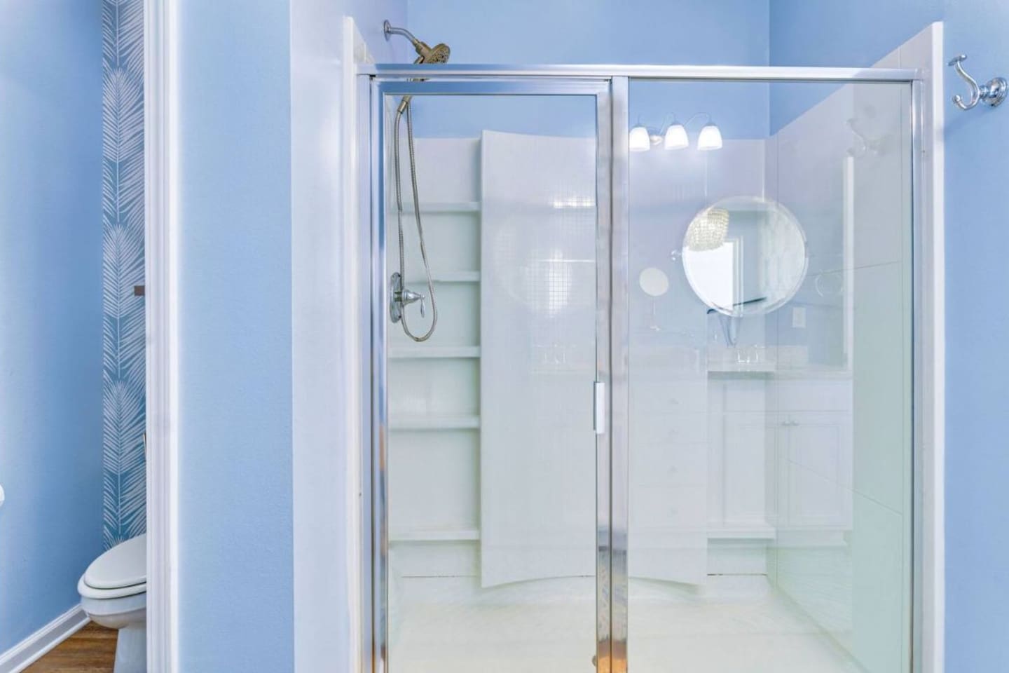 Spacious walk-in glass shower with modern finishes for a refreshing spa-like experience