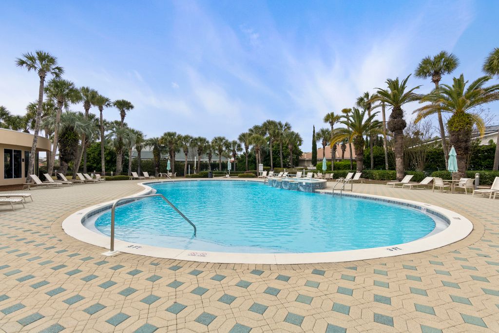 Club House Pool with loungers, tables, and plenty of seating