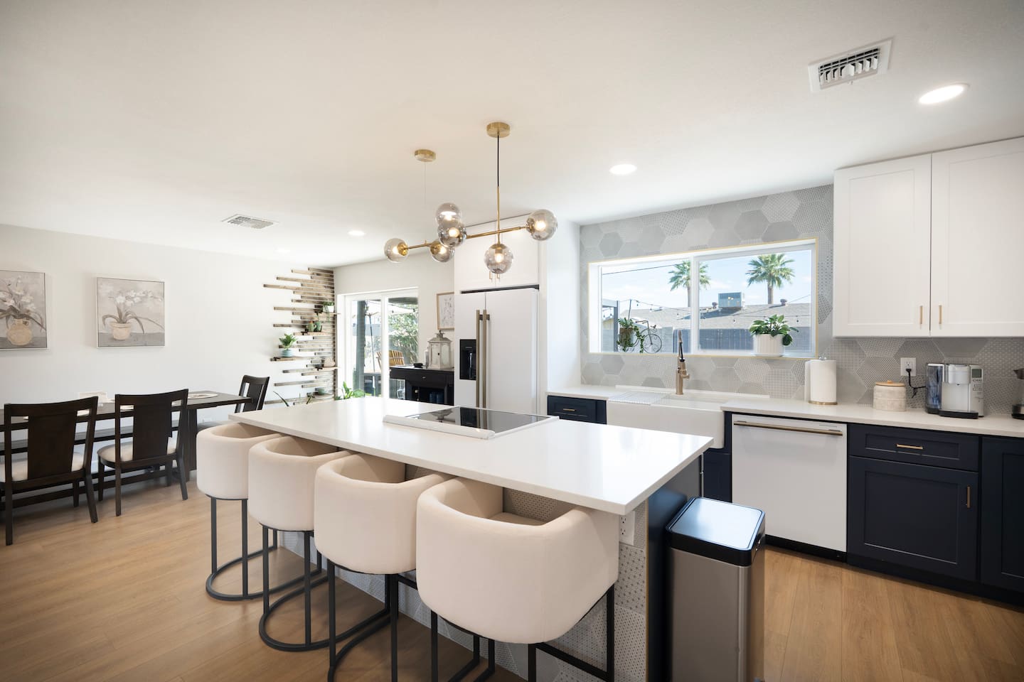 Open-concept living designed for connection—seamless flow from kitchen to dining to outdoor space in your Scottsdale retreat